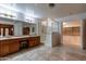 Spacious bathroom with double sinks, large shower, and walk-in closet at 13108 N 76Th St, Scottsdale, AZ 85260