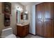 Guest bathroom with single sink and storage at 13108 N 76Th St, Scottsdale, AZ 85260