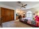 Spacious bedroom with double doors and ceiling fan at 13108 N 76Th St, Scottsdale, AZ 85260