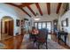 Formal dining room with hardwood floors, large windows and a wooden hutch at 13108 N 76Th St, Scottsdale, AZ 85260