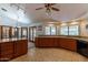 Kitchen with an island, wood cabinets, and access to the backyard at 13108 N 76Th St, Scottsdale, AZ 85260