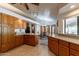 Spacious kitchen featuring wood cabinets, ample counter space, and a breakfast nook at 13108 N 76Th St, Scottsdale, AZ 85260