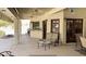 Covered patio features seating area and access to the interior at 13108 N 76Th St, Scottsdale, AZ 85260