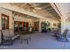 Spacious covered patio with comfortable seating and dining areas at 13108 N 76Th St, Scottsdale, AZ 85260