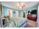 Primary bedroom with a king-size bed and teal walls at 13652 W Fargo Dr, Surprise, AZ 85374