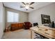 Bright bedroom with a wooden dresser and comfy armchair at 13652 W Fargo Dr, Surprise, AZ 85374