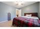 Cozy bedroom with a double bed and plaid comforter at 13652 W Fargo Dr, Surprise, AZ 85374
