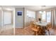 Bright dining area with a view into the kitchen and access to the entryway at 13652 W Fargo Dr, Surprise, AZ 85374