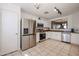 Updated kitchen, featuring stainless steel appliances and white cabinets at 13652 W Fargo Dr, Surprise, AZ 85374