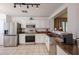 Modern kitchen with stainless steel appliances and white cabinetry at 13652 W Fargo Dr, Surprise, AZ 85374