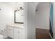 Small bathroom with white vanity and black framed mirror at 1449 E Highland Ave # 36, Phoenix, AZ 85014