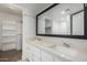 Bathroom boasts double vanity, large mirror and built-in shelving at 1449 E Highland Ave # 36, Phoenix, AZ 85014