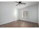 Bright bedroom with wood-look tile floors and ceiling fan at 1449 E Highland Ave # 36, Phoenix, AZ 85014