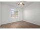 Well-lit bedroom featuring wood-look tile floors and window at 1449 E Highland Ave # 36, Phoenix, AZ 85014