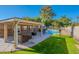 Inviting backyard oasis featuring a sparkling pool, patio, and lush lawn at 1822 E Bethany Home Rd, Phoenix, AZ 85016