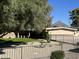 House with a lush green lawn, mature trees, and mountain view at 1822 E Bethany Home Rd, Phoenix, AZ 85016