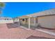 Spacious backyard with covered patio and gravel landscaping at 20058 N 109Th Dr, Sun City, AZ 85373