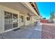 Covered patio with ceiling fan, sliding glass door and backyard access at 20058 N 109Th Dr, Sun City, AZ 85373