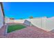 Landscaped backyard with artificial turf and gravel at 20058 N 109Th Dr, Sun City, AZ 85373