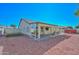 Covered patio, artificial turf, gravel yard and storage shed at 20058 N 109Th Dr, Sun City, AZ 85373