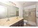 Double vanity bathroom with a large walk-in shower at 20058 N 109Th Dr, Sun City, AZ 85373