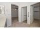 Bathroom with a vanity and access to the bedroom and closet at 20058 N 109Th Dr, Sun City, AZ 85373