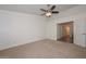 Bright bedroom with ceiling fan and carpet flooring at 20058 N 109Th Dr, Sun City, AZ 85373