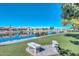 Serene canal view with benches and lush grass at 20058 N 109Th Dr, Sun City, AZ 85373