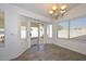 Bright dining area with tile floors and access to backyard at 20058 N 109Th Dr, Sun City, AZ 85373