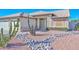 Front yard with drought-tolerant landscaping and a welcoming entryway at 20058 N 109Th Dr, Sun City, AZ 85373