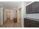 Hallway with tile flooring and built-in storage at 20058 N 109Th Dr, Sun City, AZ 85373