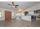 Spacious kitchen with island, stainless steel appliances, and dark wood cabinets at 20058 N 109Th Dr, Sun City, AZ 85373