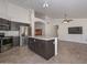 Kitchen features stainless steel appliances and dark wood cabinets at 20058 N 109Th Dr, Sun City, AZ 85373