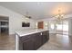 Open kitchen with island and dark cabinetry at 20058 N 109Th Dr, Sun City, AZ 85373