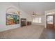 Living room featuring stained glass window and hardwood floors at 20058 N 109Th Dr, Sun City, AZ 85373