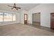 Bright living room with carpeted floors and high ceilings at 20058 N 109Th Dr, Sun City, AZ 85373