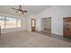 Bright living room with carpeted floors and high ceilings at 20058 N 109Th Dr, Sun City, AZ 85373