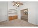 Home office with built-in shelves and cabinets at 20058 N 109Th Dr, Sun City, AZ 85373