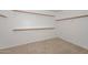 Large walk-in closet with hanging rods and shelving at 20058 N 109Th Dr, Sun City, AZ 85373