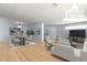 Bright dining room featuring a large table and chairs, hardwood floors, and modern decor at 214 S Hing Dr, Superior, AZ 85173