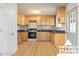 Bright kitchen featuring wood cabinets and granite countertops at 214 S Hing Dr, Superior, AZ 85173