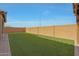 Artificial turf lawn with brick pavers and block wall at 22446 E Russet Rd, Queen Creek, AZ 85142
