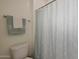Clean bathroom with shower and patterned shower curtain at 22446 E Russet Rd, Queen Creek, AZ 85142