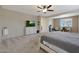 Spacious bedroom with carpeted floors and large window at 22446 E Russet Rd, Queen Creek, AZ 85142
