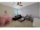 bedroom with play tent, couch and bookshelf at 22446 E Russet Rd, Queen Creek, AZ 85142