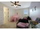 bedroom with play tent, couch, and bookshelf at 22446 E Russet Rd, Queen Creek, AZ 85142