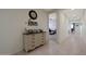 Hallway with decorative dresser and view into a bedroom at 22446 E Russet Rd, Queen Creek, AZ 85142