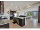 Open kitchen with large island and stainless steel appliances at 22446 E Russet Rd, Queen Creek, AZ 85142