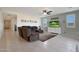 Living room with sectional sofa and view of kitchen at 22446 E Russet Rd, Queen Creek, AZ 85142