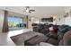 Open floor plan living room with sliding glass doors to backyard at 22446 E Russet Rd, Queen Creek, AZ 85142